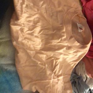 Peach shirt- size XL it’s wrinkled but I will wash it before shipping!
